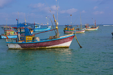 Naklejka na ściany i meble Fishing Boats in Weligama, Sri Lanka. Sri Lankan Fishing. Sea view from the Port.