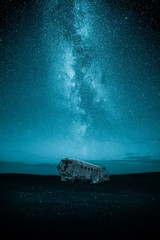plane wreck at night with milky way on the sky - obrazy, fototapety, plakaty