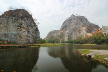 Fototapeta na wymiar Beautiful Rocky mountain with water lake of khao Ngu Stone Park , Ratchaburi , Thailand.