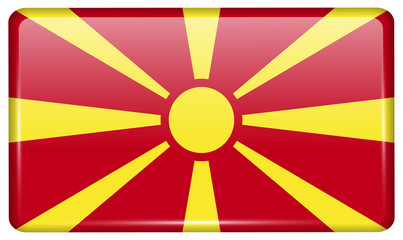 Flags Macedonia in the form of a magnet on refrigerator with reflections light.