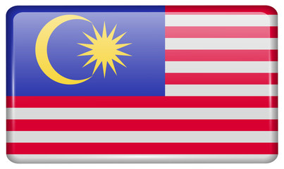 Flags Malaysia in the form of a magnet on refrigerator with reflections light.
