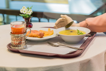 artificial served food on the table and hand of mannequin