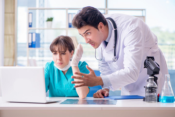 Fototapeta premium Doctor angry at his assistant due to medical error