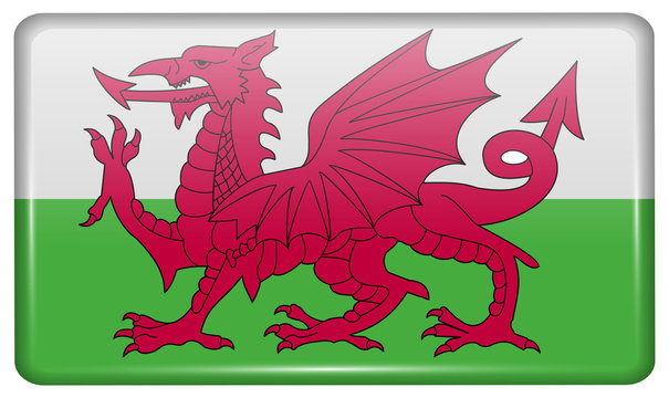 Flags Wales in the form of a magnet on refrigerator with reflections light.