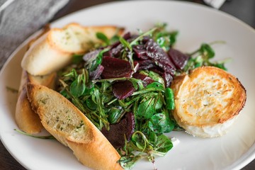 Green slad with beetroot and goat cheese.