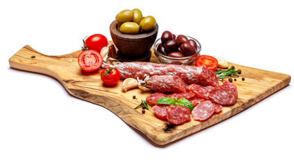 Dried organic salami sausage or chorizo on wooden cutting board