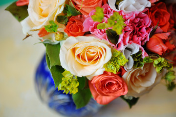 Bouquet of a bride in a blue vase. Beautiful colorful wedding bouquet. Black and white.