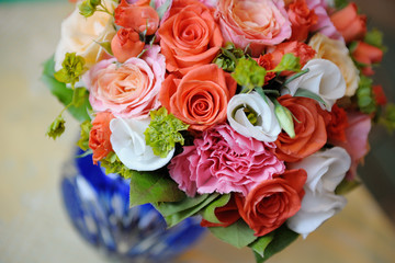 Bouquet of a bride in a blue vase. Beautiful colorful wedding bouquet. Black and white.