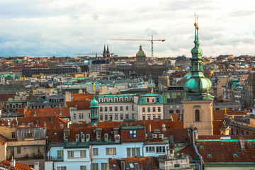 Panorama of the city of Prague. The old part of the city. Beautiful roofs of shingles. Ancient buildings and churches.