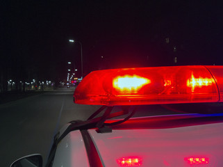 Police car lights in night time, crime scene, night patrolling the city. © Evgen