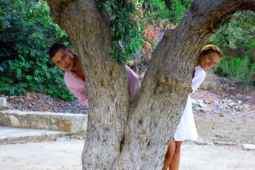 beautiful gorgeous couple on the tree of love cedar, on cyprus