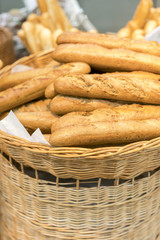 Fresh baguettes in a wicker basket