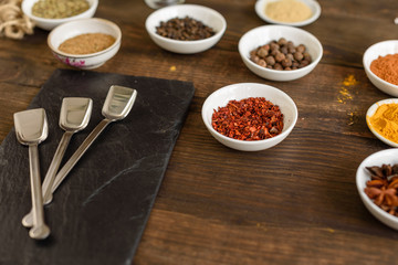 Various spices against a dark background. Food ingredients