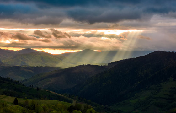 beams of light over the mountains