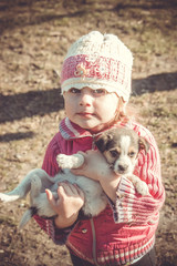 child and puppy