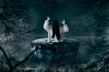 Witch in white shirt gets out of an abandoned well