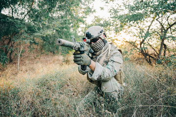 Fototapeta premium Military camouflage to find opportunities to shoot enemies in the grass,soldier war concept