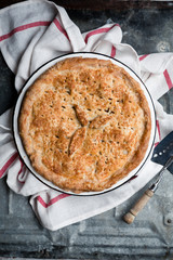 rustic home made pie with tea towel