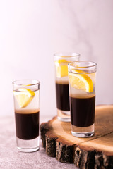 Alcoholic cocktail silver bullet with gin, coffee liqueur and lemon.