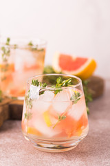 Gin bitter lemon with thyme and grapefruit. Fruit lemonade.