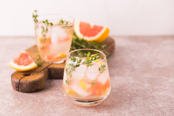 Gin bitter lemon with thyme and grapefruit. Fruit lemonade.