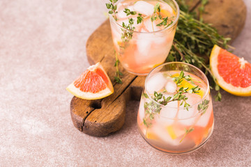 Gin bitter lemon with thyme and grapefruit. Fruit lemonade.
