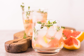 Gin bitter lemon with thyme and grapefruit. Fruit lemonade.