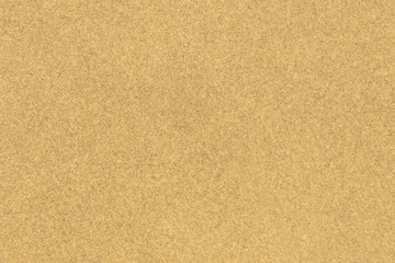 Fototapeta na wymiar Yellow sand under water on a summer beach close-up - beautiful background