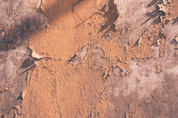 Wall with remains of beige paint - light grunge background