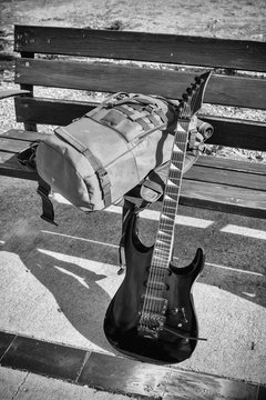 Guitar on a park bench