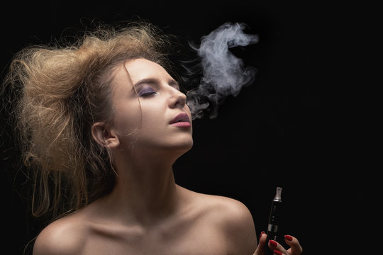 woman smoking electronic cigarette