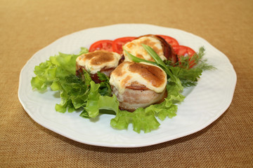 Medallions of pork and bacon.