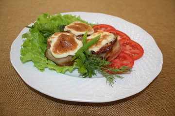 Medallions of pork and bacon.