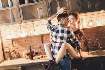 Fototapeta na wymiar Romantic dinner concept. Passion picture. Sensual couple kissing and hug