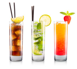Set of cocktails in classical glasses with slice of lemon and black straw isolated on white background with clipping path