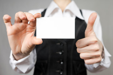 Businesswoman holding a business card. Mock up. Copy space.