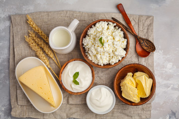 Different types of dairy products on white background, top view, copy space