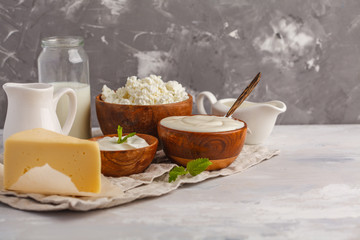 Different types of dairy products on white gray background, copy space. Food background, healthy food concept