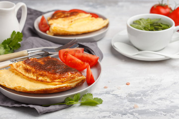 Delicious bright egg omelet with cheese and vegetables. Breakfast food concept, white background