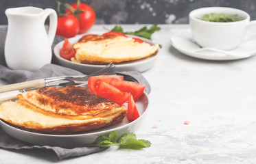 Delicious bright egg omelet with cheese and vegetables. Breakfast food concept, white background