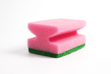 Obraz na płótnie Canvas Photo of a dish sponge that consists of pink foam and green abrasive on a white background