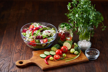 fresh vegetables on the cutting board over wooden background, selective focus, shallow depth of field