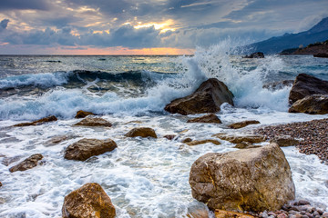 sunset over the sea with beautiful wave