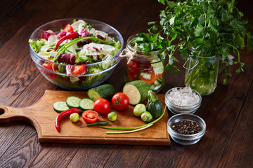 fresh vegetables on the cutting board over wooden background, selective focus, shallow depth of field