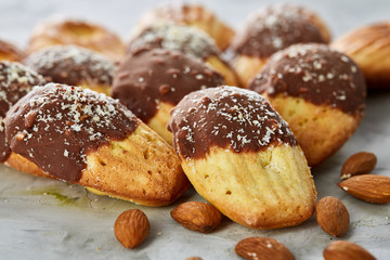 Tasty almond cookies arranged in the shape of fan on white background, close-up, selective focus