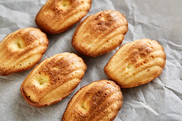 Tasty almond cookies arranged in the shape of fan on white background, close-up, selective focus