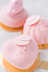 three pastel pink cake on white wooden table. Little dessert served with tea or coffee. wallpaper, Vertical photo