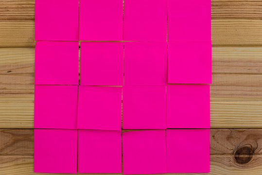 Note book and post-it notes on wooden background