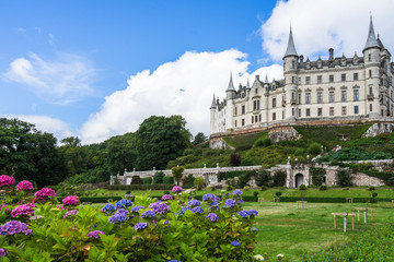 Fairytale view of Dunrobin Castle, with a magnificent garden full of flowers, Sutherland, Scotland, Britain