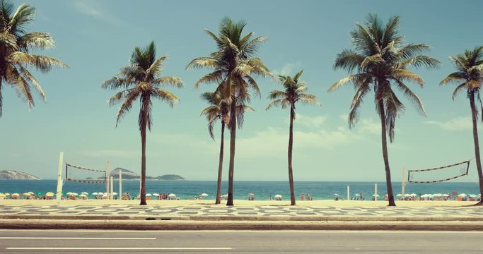 Sunny day with Palms on Ipanema Beach in Rio De Janeiro, Brazil. Vintage colors